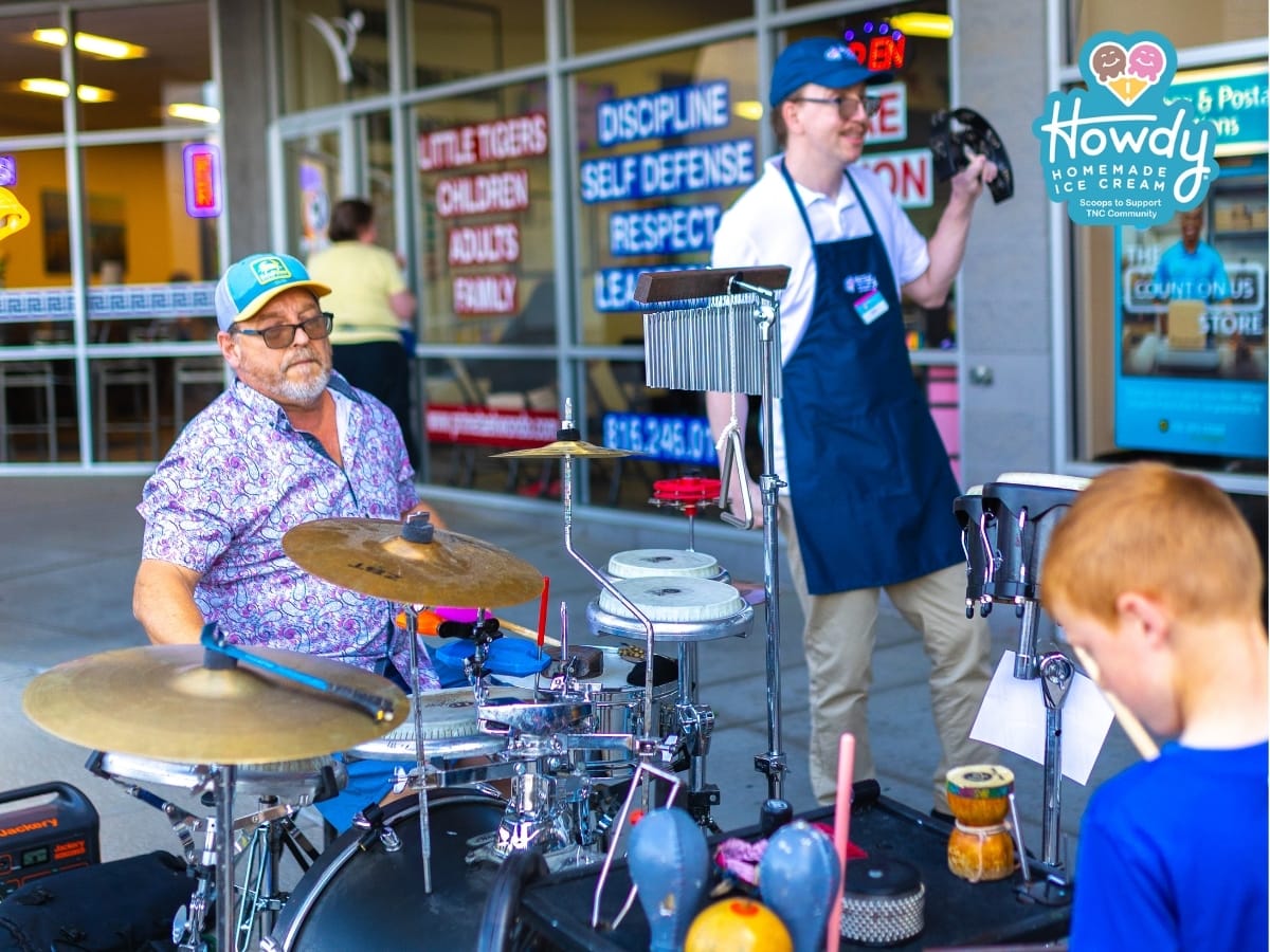 Carl Cherrito of Power Percussion playing live music with Eric, a Howdy Homemade Hero at the grand opening celebration.